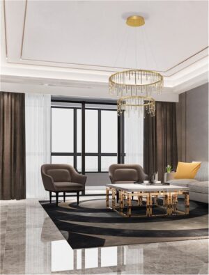 image shows an led chandelier in brass hanging in a large sitting room with grey floor tiles